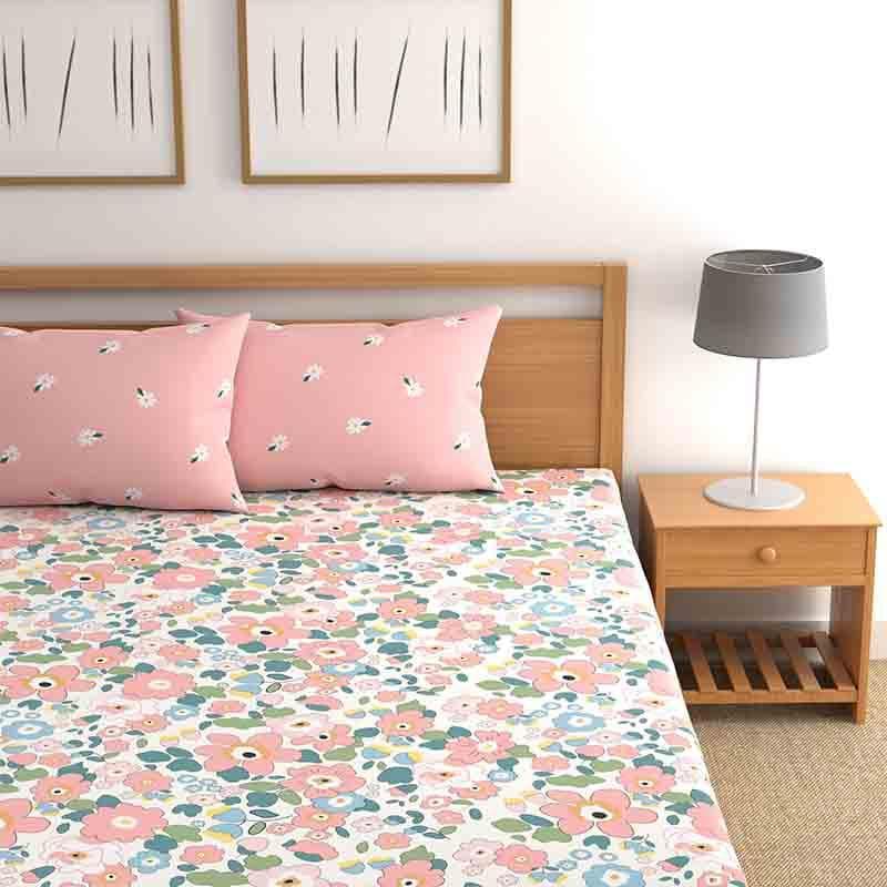 Close up of the Blushing Blooms, a printed pink floral king size bedsheet you can buy online at Sukham Home, a sustainable furniture, gardening and home decor store in Kolkata, India