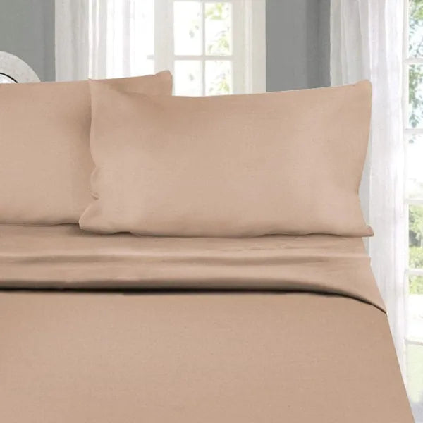 Placed on a king size bed, the California Dreams, a solid nude rose-pink super king size bedsheet you can buy online at Sukham Home, a sustainable furniture, gardening and home decor store in Kolkata, India