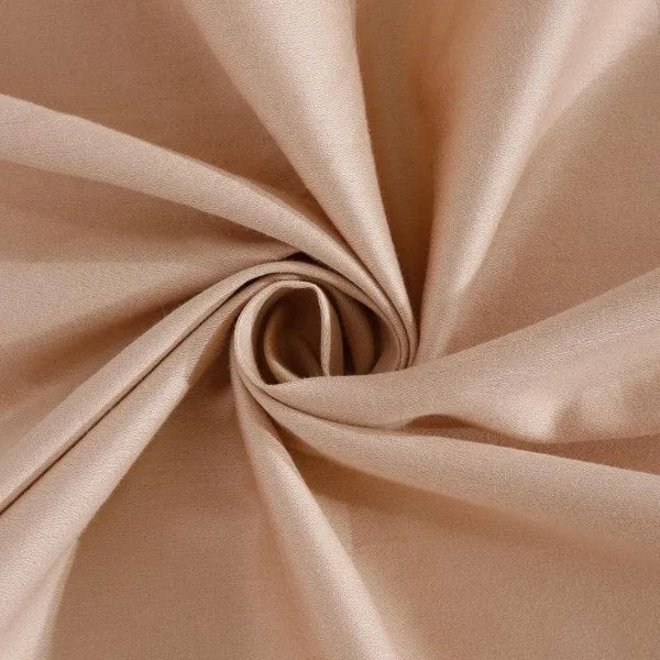 Close up of the material on the California Dreams, a solid nude rose-pink super king size bedsheet you can buy online at Sukham Home, a sustainable furniture, gardening and home decor store in Kolkata, India