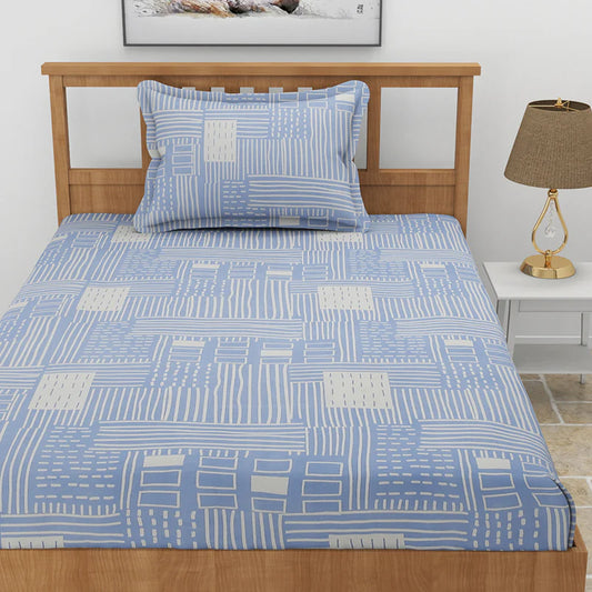 Top view of the Cerulean Shores, a printed blue geometric queen size bedsheet you can buy online at Sukham Home, a sustainable furniture, gardening and home decor store in Kolkata, India