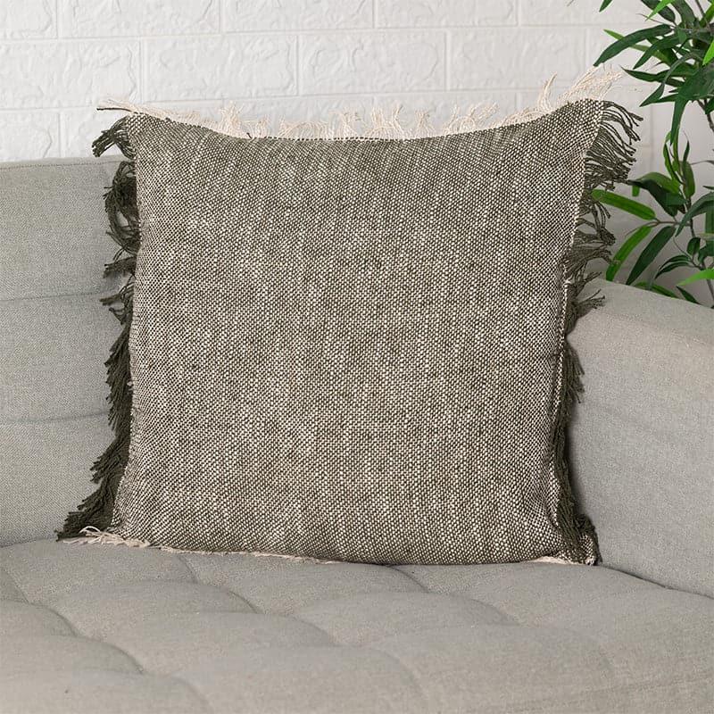 Placed on a sofa, the Charcoal Textured Cushion, a square black and white accent pillow you can buy online at Sukham Home, a sustainable furniture, kitchen & dining and home decor store in Kolkata, India