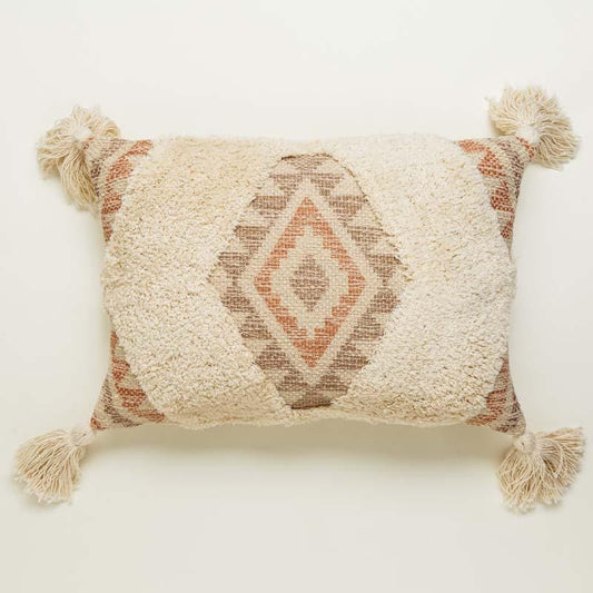 Against a white background a piece of the Ellora Cushion, a rectangular tasseled and tufted accent pillow with diamond prints you can buy online at Sukham Home, a sustainable furniture, kitchen & dining and home decor store in Kolkata, India.