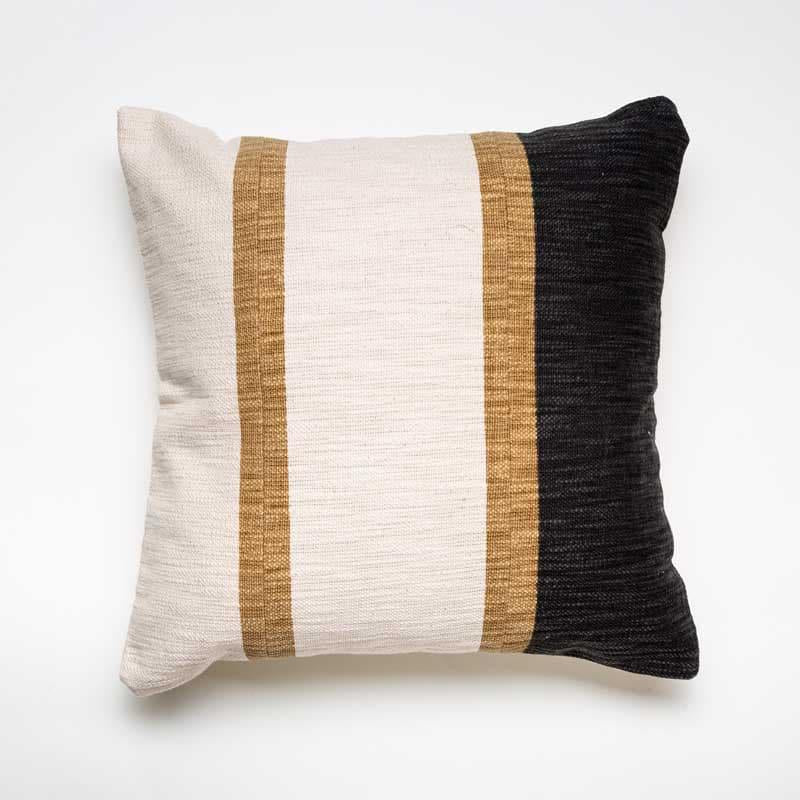 Against a white background, Inked in Charcoal Cushion, a square black and white and brown striped accent pillow you can buy online at Sukham Home, a sustainable furniture, kitchen & dining and home decor store in Kolkata, India