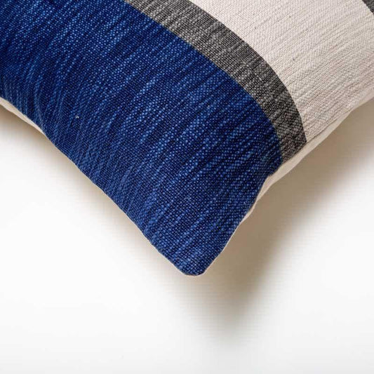 Corner of the Inked in Indigo Cushion, a square navy blue and white and brown striped accent pillow you can buy online at Sukham Home, a sustainable furniture, kitchen & dining and home decor store in Kolkata, India