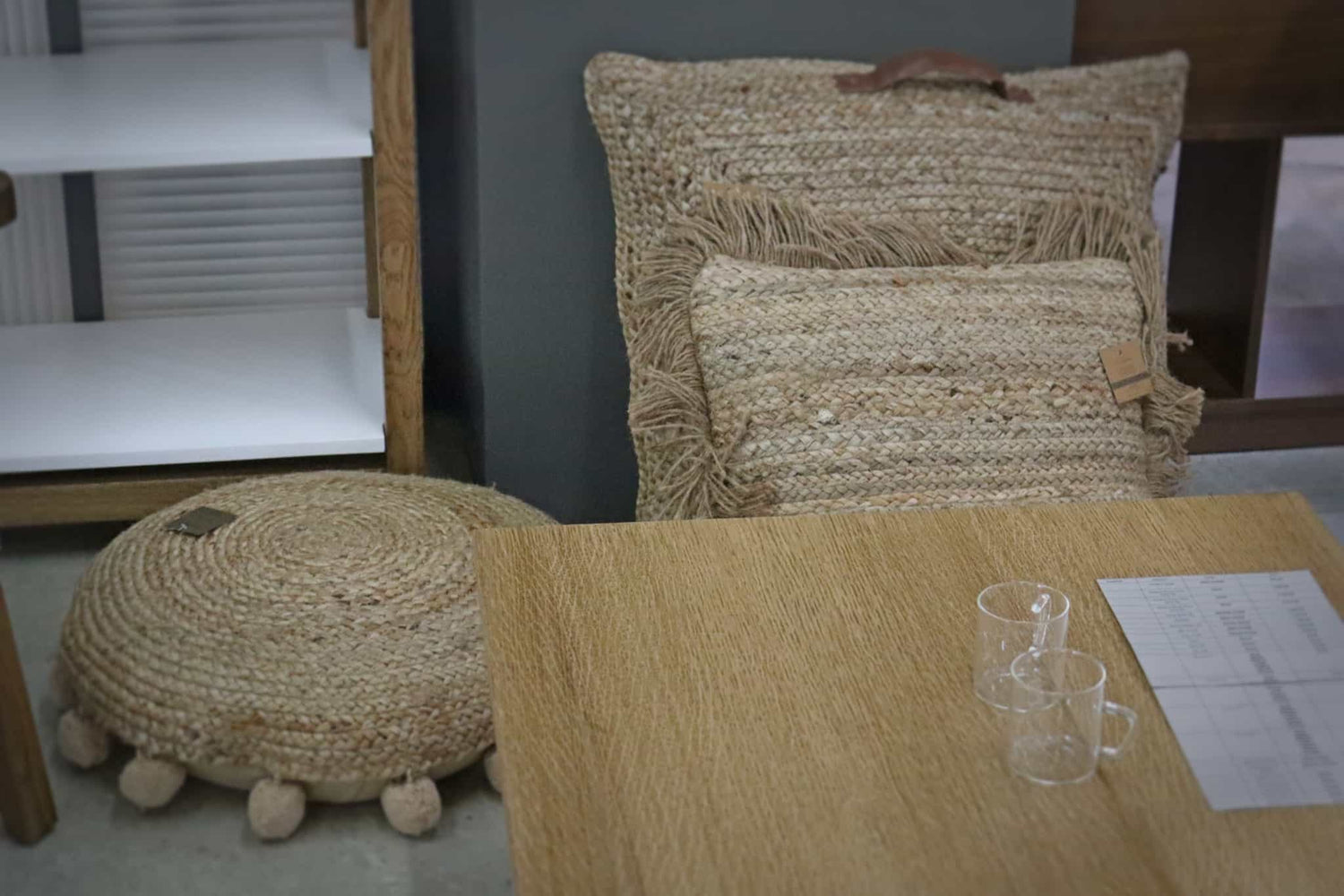 Jute square and round floor cushions and a centre table at Su-Kham Home, the sustainable furniture, kitchen & dining and home decor store in Kolkata, West Bengal that ships all over India