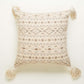Against a white background the Mawsmai Cushion, a square accent pillow with tassels and ethnic prints you can buy online at Sukham Home, a sustainable furniture, kitchen & dining and home decor store in Kolkata, India.