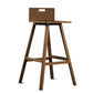 Against a white background, the Oak Antique Flamingo Bar Stool, a solid wood high bar chair you can buy online at Sukham Home, a sustainable furniture and home decor store in Kolkata, India