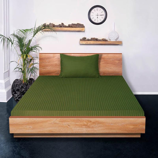 The full look of the Olive Streaks Bedsheet, arranged on a bed, a king size cotton bedsheet you can buy online at Sukham Home, a sustainable furniture, gardening and home decor store in Kolkata, India