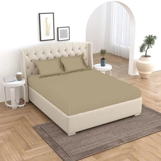 Laid out on a bed, the Over The Taupe, a solid beige-brown super king size bedsheet you can buy online at Sukham Home, a sustainable furniture, gardening and home decor store in Kolkata, India