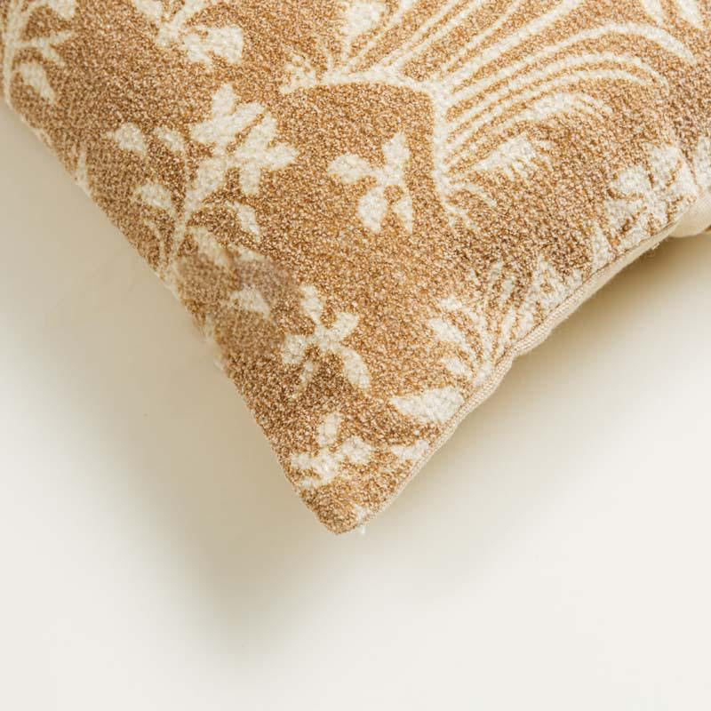 Corner closeup of the Panchatantra Tales Cushion, a rectangle accent pillow with indie folk patterns you can buy online at Sukham Home, a sustainable furniture, kitchen & dining and home decor store in Kolkata, India.