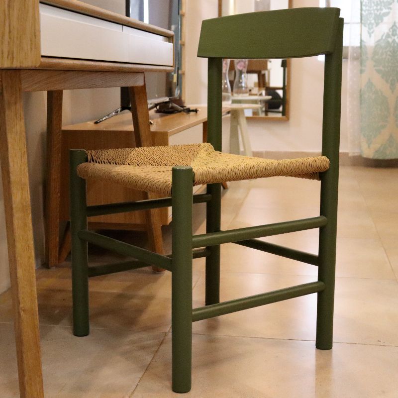 The PU Ollive Green finish People's, a solid oak wood chair with a danish cord seat you can buy online at Sukham Home, a sustainable furniture and home decor store in Kolkata, India