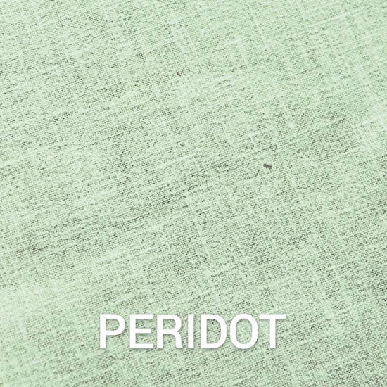Peridot Green, a cotton upholstery fabric available at Su-Kham Home, a sustainable furniture and home decor store based out of Kolkata, India