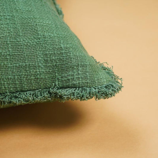 Corner closeup of the Sage Textured Cushion, a square accent pillow with joyful colour pattern you can buy online at Sukham Home, a sustainable furniture, kitchen & dining and home decor store in Kolkata, India.