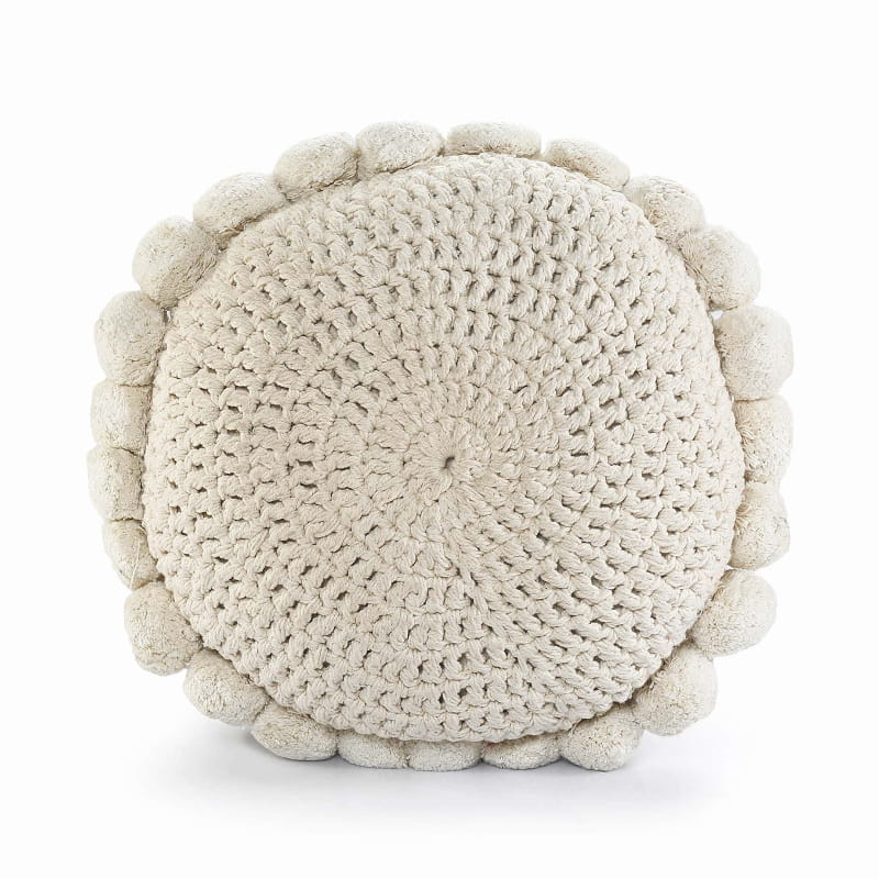 Against a white background is the Snowball Crochet Cushion, a round accent pillow with crochet and fluffy pom poms which you can buy online at Sukham Home, a sustainable furniture, kitchen & dining and home decor store in Kolkata, India.