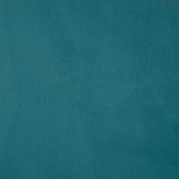 Close up of the colour of the Teal-Licious, a solid blue-green super king size bedsheet you can buy online at Sukham Home, a sustainable furniture, gardening and home decor store in Kolkata, India