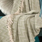 Close-up of the Monochromatic Polka Dot Throw, a green and white throw you can buy online at Sukham Home, a sustainable furniture, kitchen & dining and home decor store in Kolkata, India
