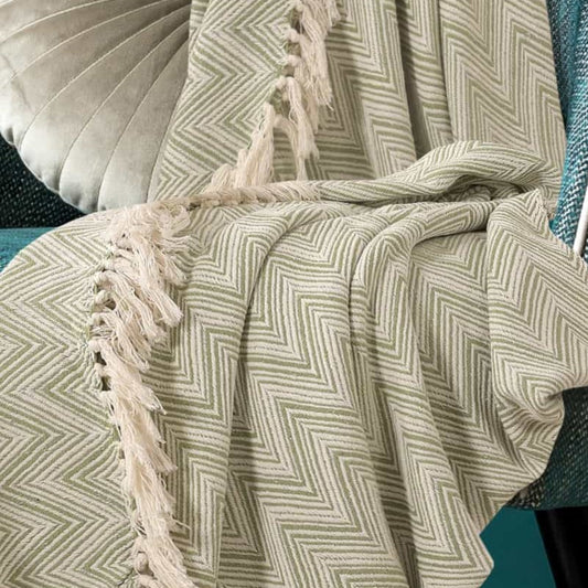 Close-up of the Monochromatic Polka Dot Throw, a green and white throw you can buy online at Sukham Home, a sustainable furniture, kitchen & dining and home decor store in Kolkata, India