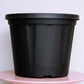 Close up of the 14 inch black nursery pot and gardening tools you can buy online at Sukham Home, a sustainable furniture, gardening and home decor store in Kolkata, India