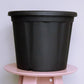 Close up of the 16 inch black nursery pot and gardening tools you can buy online at Sukham Home, a sustainable furniture, gardening and home decor store in Kolkata, India