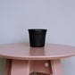 Distant view of the 3 inch black nursery pot and gardening tools you can buy online at Sukham Home, a sustainable furniture, gardening and home decor store in Kolkata, India