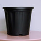 Close up of the 8 inch black nursery pot and gardening tools you can buy online at Sukham Home, a sustainable furniture, gardening and home decor store in Kolkata, India
