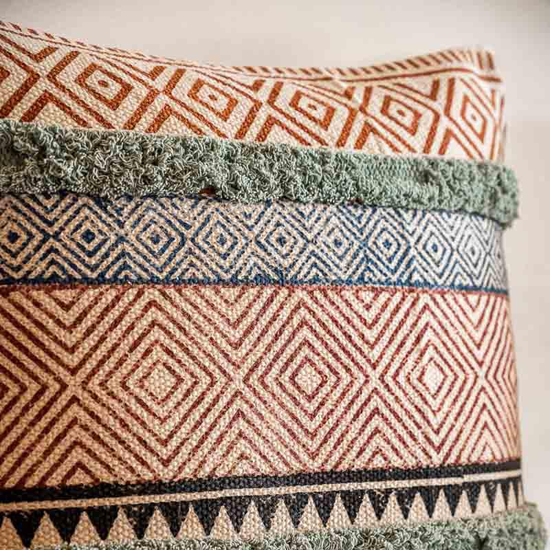 Close up of the handpainted pattern on the Abstract Fantasy Cushion, a cotton handpainted and tufted accent pillow you can buy online at Sukham Home, a sustainable furniture, kitchen & dining and home decor store in Kolkata, India