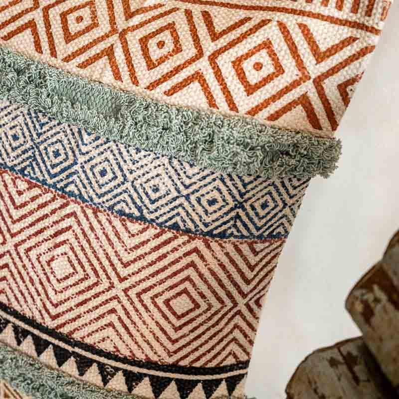 Close up of the tufting on the Abstract Fantasy Cushion, a cotton handpainted and tufted accent pillow you can buy online at Sukham Home, a sustainable furniture, kitchen & dining and home decor store in Kolkata, India