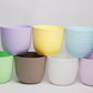 All colours of Verona, a round colourful indoor planter made from plastic that you can buy online at Sukham Home, a sustainable furniture, gardening and home decor store in Kolkata, India