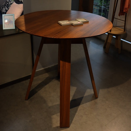 In Walnut Natural, the Alpine, a wooden high round bar table you can buy online at Sukham Home, a sustainable furniture, kitchen & dining and home decor store in Kolkata, India
