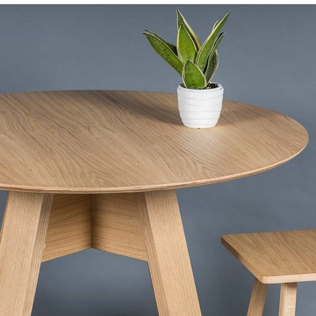 Close up of the top of the Alpine, a wooden high round bar table you can buy online at Sukham Home, a sustainable furniture, kitchen & dining and home decor store in Kolkata, India