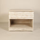 Front view of the Archaic Bedside Table, a wooden white patina nightstand inspired by harbour and coastal style furniture you can buy online at Sukham Home, a sustainable furniture, kitchen & dining and home decor store in Kolkata, India