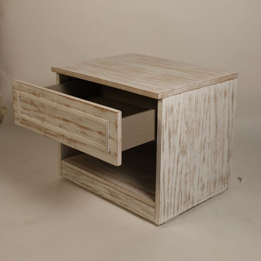 Top drawer open of the Archaic Bedside Table, a wooden white patina nightstand inspired by harbour and coastal style furniture you can buy online at Sukham Home, a sustainable furniture, kitchen & dining and home decor store in Kolkata, India