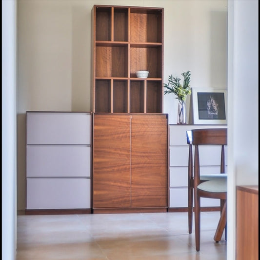 Set in a dining room, the Walnut Natural Arry Dining Cabinet, a wooden crockery and storage solution you can buy online at Sukham Home, a sustainable furniture, kitchen & dining and home decor store in Kolkata, India