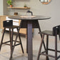In Ash Grey, the Alpine, a wooden high round bar table you can buy online at Sukham Home, a sustainable furniture, kitchen & dining and home decor store in Kolkata, India