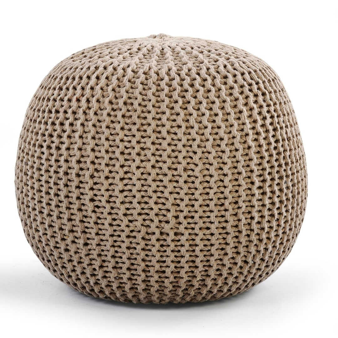 Against a white background, the Beige Knitted Pouf, an sandy brown ottoman made from cotton, available at Sukham Home, a sustainable furniture, kitchen & dining and home decor store in Kolkata, India