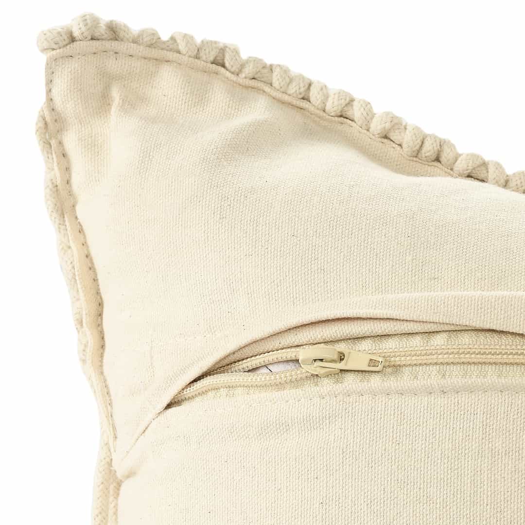 Close up of the zip of the Beige White Macrame Cushion with Fringes, a rectangle accent pillow you can buy online at Sukham Home, a sustainable furniture, kitchen & dining and home decor store in Kolkata, India