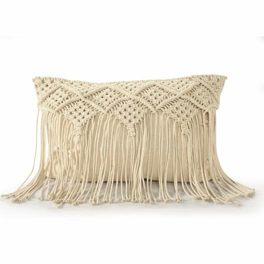 Against a white background, the Beige White Macrame Cushion with Fringes, a rectangle accent pillow you can buy online at Sukham Home, a sustainable furniture, kitchen & dining and home decor store in Kolkata, India