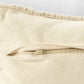 Close up of the zip of the Beige White Macrame Cushion with Fringes, a square accent pillow you can buy online at Sukham Home, a sustainable furniture, kitchen & dining and home decor store in Kolkata, India