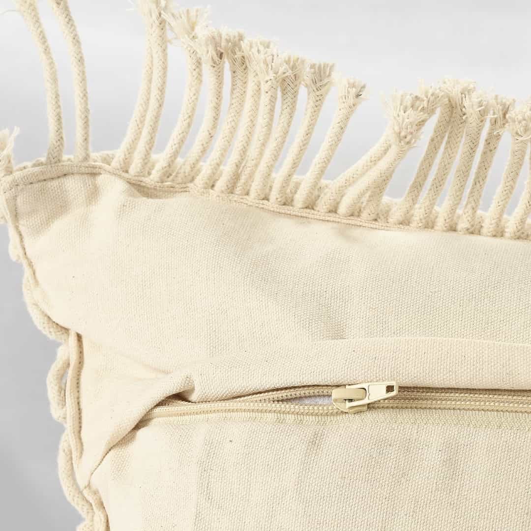 Close up of the zip of the Beige White Macrame Cushion, a square accent pillow you can buy online at Sukham Home, a sustainable furniture, kitchen & dining and home decor store in Kolkata, India