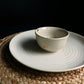 Beige Ganga Small Bowl and Beige Ganga Dinner Plate - a beige and 24-karat gold ceramic plate you can buy online at Sukham Home, a sustainable furniture, gardening and home decor store in Kolkata, India