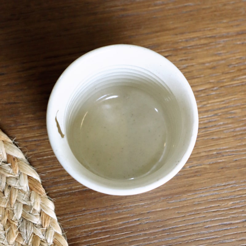 Top view of the Beige Ganga Kulhad, an off-white and 24-karat gold ceramic cup/glass you can buy online at Sukham Home, a sustainable furniture, gardening and home decor store in Kolkata, India