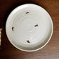 Top view of Beige Ganga Quarter Plate, an off-white and 24-karat gold ceramic small plate you can buy online at Sukham Home, a sustainable furniture, gardening and home decor store in Kolkata, India