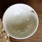 Top view of the Beige Ganga Small Bowl, an off-white and 24-karat gold ceramic small bowl you can buy online at Sukham Home, a sustainable furniture, gardening and home decor store in Kolkata, India
