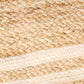 Close up of the braided texture on the Rectangular Jute Rug with White Accents, a small rectangle jute and beige cotton carpet you can buy online at Sukham Home, a sustainable furniture, kitchen & dining and home decor store in Kolkata, India