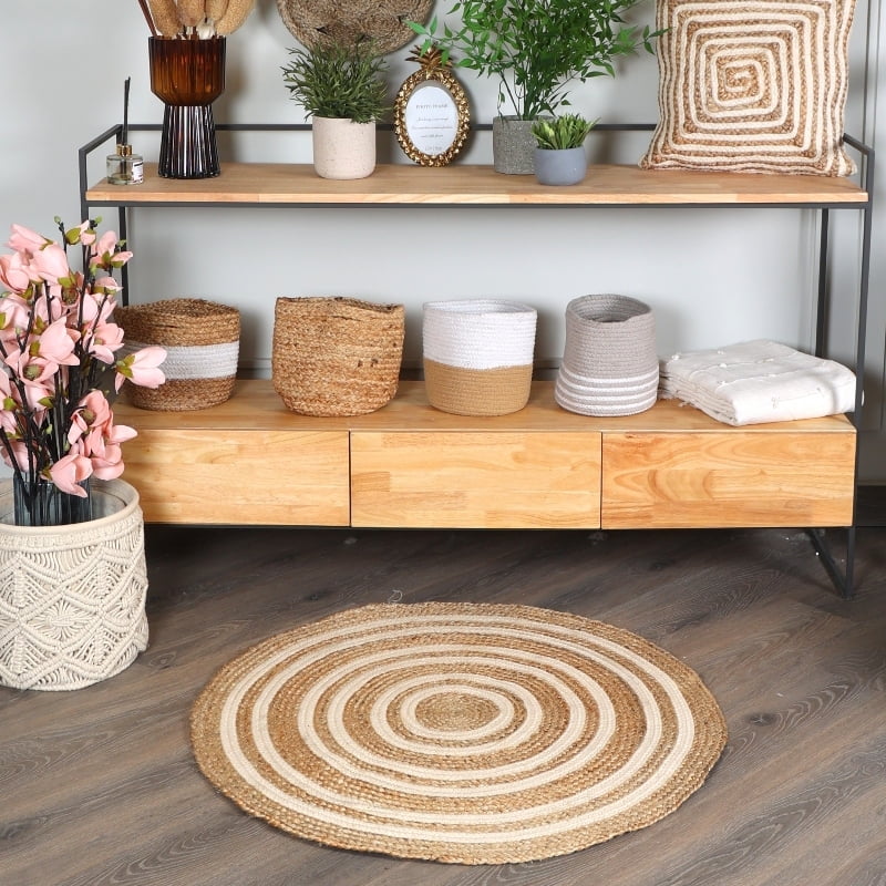 Placed below a console, the Round Jute Rug, a circular jute and white cotton carpet you can buy online at Sukham Home, a sustainable furniture, kitchen & dining and home decor store in Kolkata, India