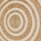 Close up of the concentric circles pattern on the Round Jute Rug, a circular jute and white cotton carpet you can buy online at Sukham Home, a sustainable furniture, kitchen & dining and home decor store in Kolkata, India