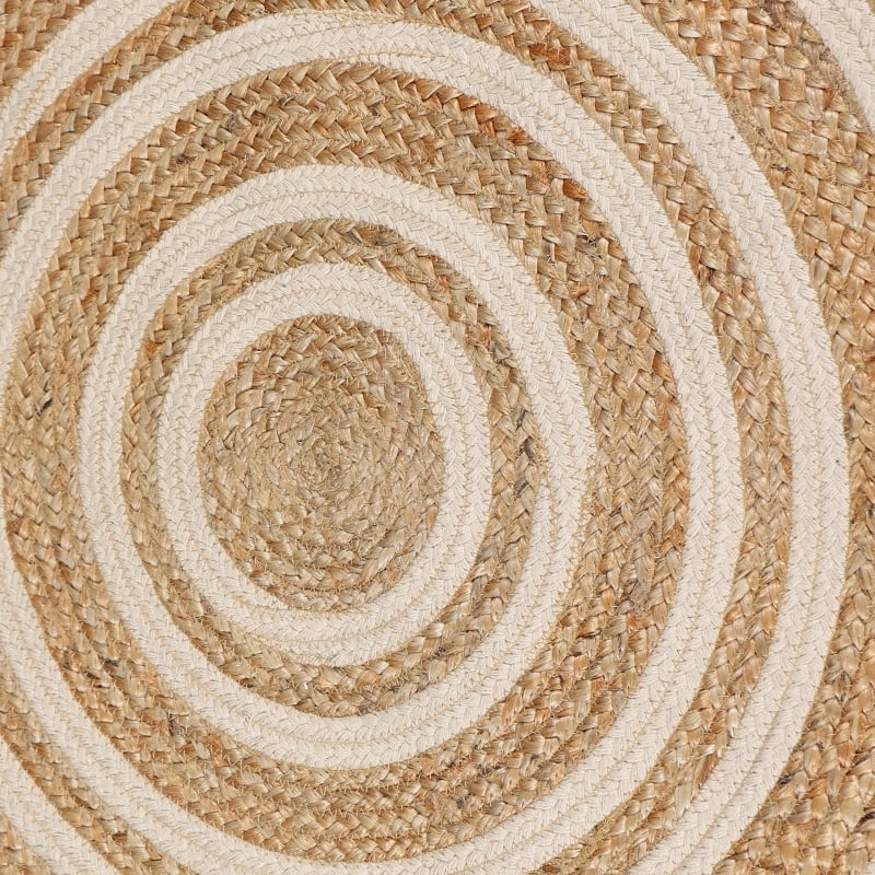 Close up of the concentric circles pattern on the Round Jute Rug, a circular jute and white cotton carpet you can buy online at Sukham Home, a sustainable furniture, kitchen & dining and home decor store in Kolkata, India