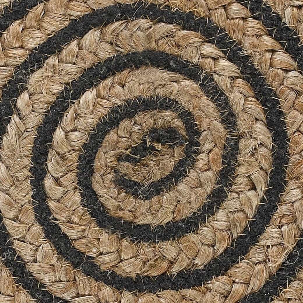 Close up of the texture and design of the Black Circle of Life Stool, a black ottoman made from jute, cotton and mango wood, available at Sukham Home, a sustainable furniture, kitchen & dining and home decor store in Kolkata, India