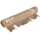 Rolled up, the Handwoven Jute Rug with Black and White Stripes and Tassels, a small rectangle jute and black & white cotton carpet you can buy online at Sukham Home, a sustainable furniture, kitchen & dining and home decor store in Kolkata, India