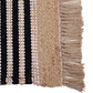Close of the jute tassels on the Handwoven Jute Rug with Black and White Stripes and Tassels, a small rectangle jute and black & white cotton carpet you can buy online at Sukham Home, a sustainable furniture, kitchen & dining and home decor store in Kolkata, India